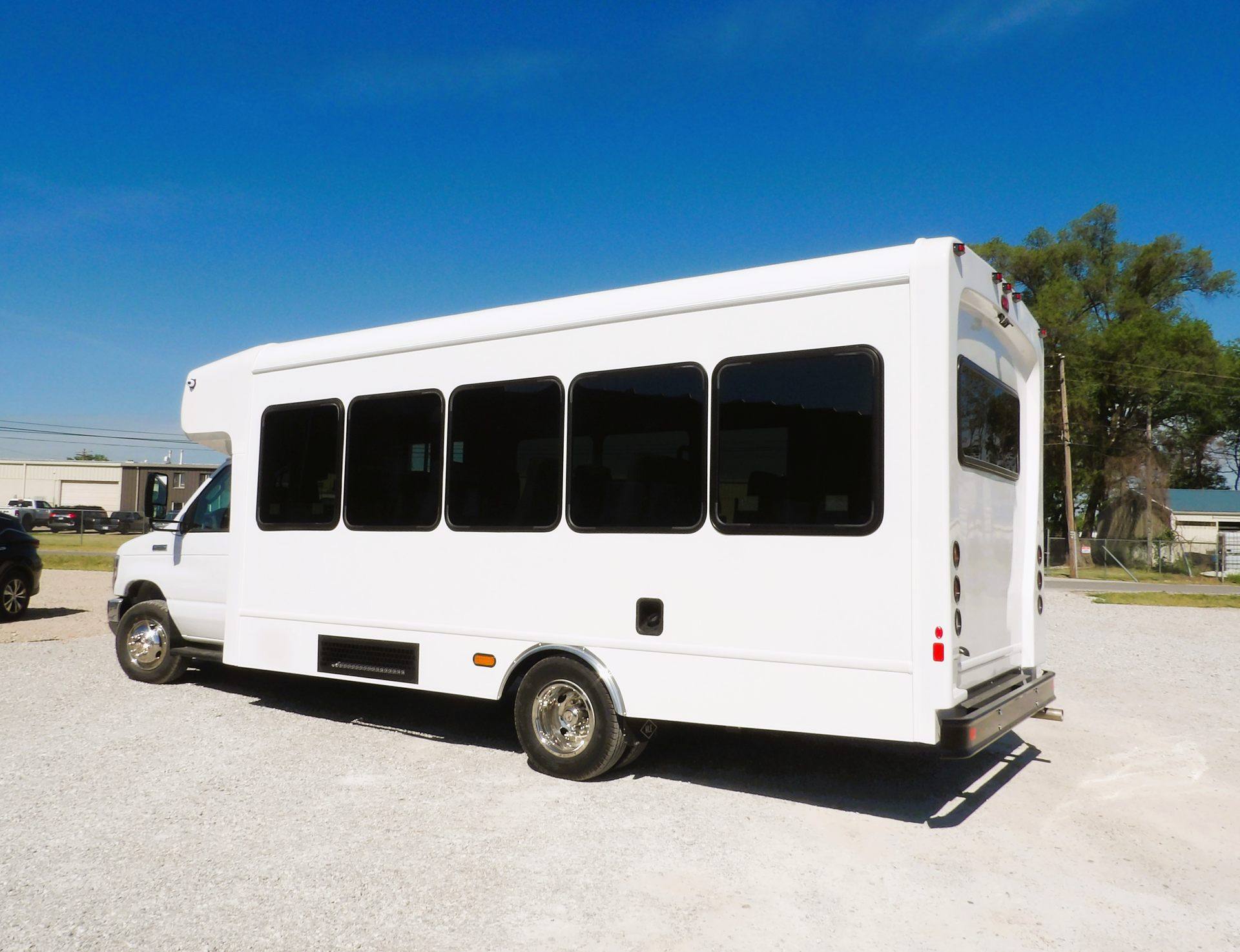 HLE Mavryk shuttle bus on the Ford E-450 chassis, driver-side angle under blue sky